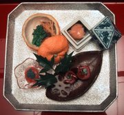 One course of a multi course Kaiseki meal, showing a careful arrangement of the foods